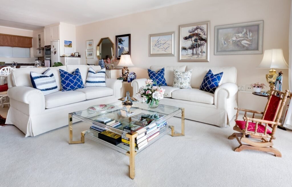 pexels-photo-1543447 Modern living room with stylish decor and comfortable white sofas.